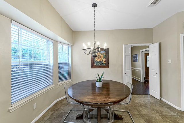 dining space with a notable chandelier