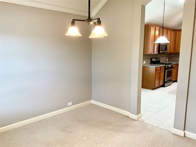 unfurnished dining area featuring crown molding and light carpet