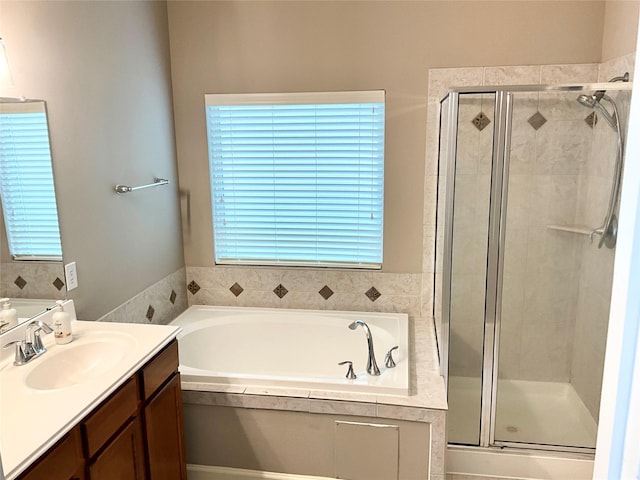 bathroom with independent shower and bath and vanity