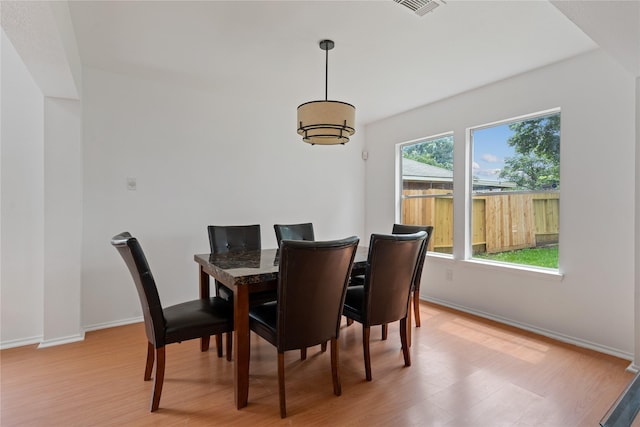 dining area with light hardwood / wood-style floors