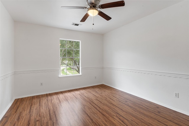 empty room with hardwood / wood-style flooring and ceiling fan