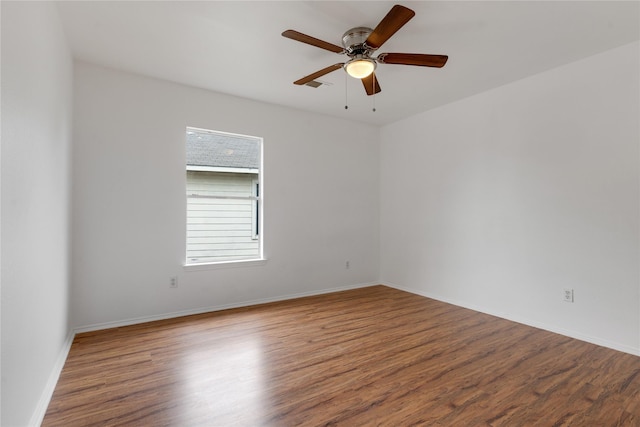 unfurnished room featuring ceiling fan and hardwood / wood-style floors