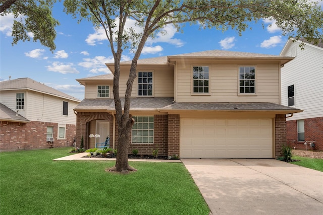 view of front facade with a garage and a front yard