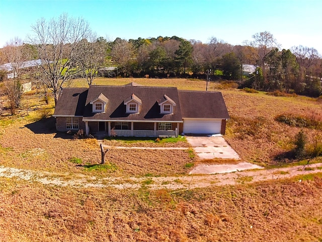 view of front of property with a garage and covered porch