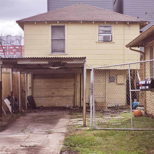 back of house with a garage