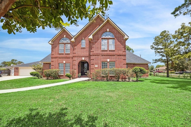 view of front of house with a garage and a front lawn