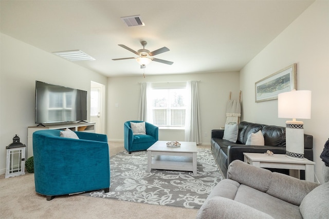 carpeted living room featuring ceiling fan