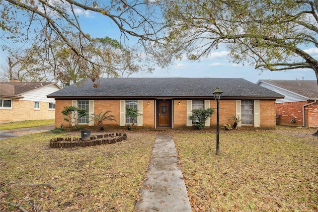 single story home with a front lawn