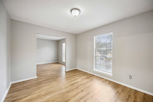 unfurnished room featuring light hardwood / wood-style floors