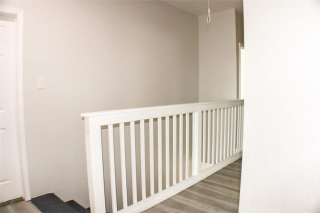 corridor featuring hardwood / wood-style floors