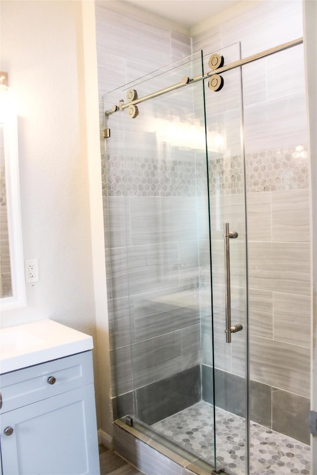 bathroom featuring vanity and walk in shower