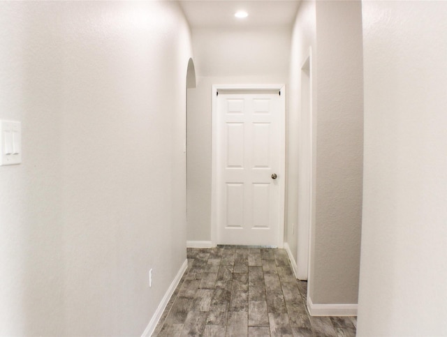 hall featuring dark wood-type flooring