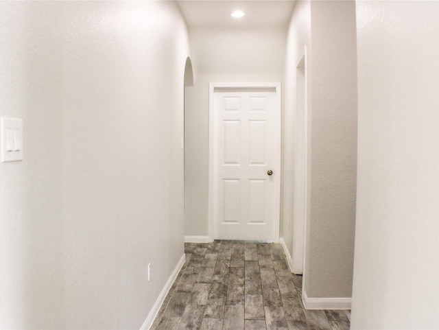 corridor with dark wood-type flooring