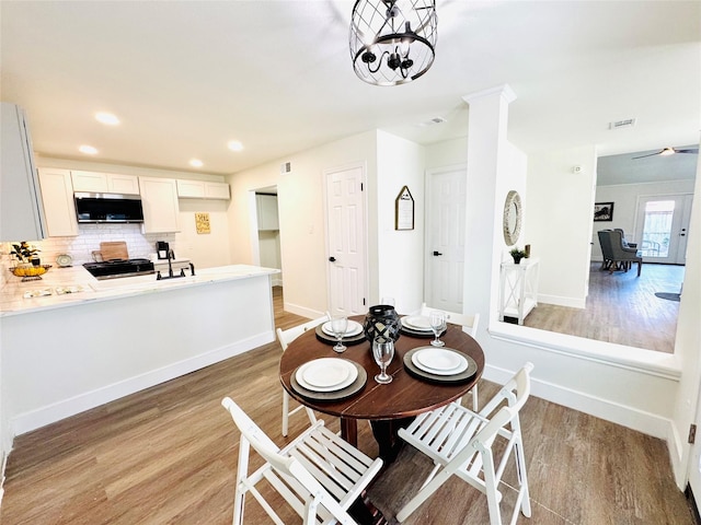 dining area with light hardwood / wood-style floors