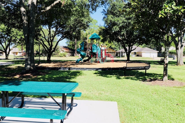 community play area featuring a lawn