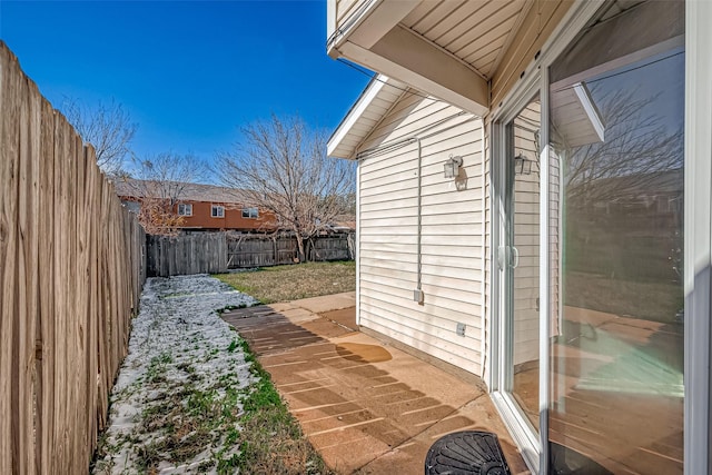 view of side of home with a patio