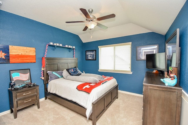 carpeted bedroom featuring ceiling fan and lofted ceiling