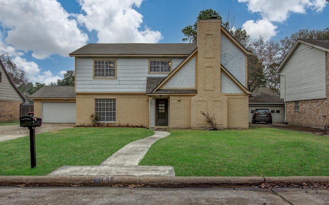 view of front of property featuring a garage and a front lawn