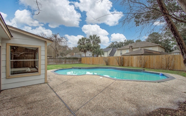 view of swimming pool with a patio