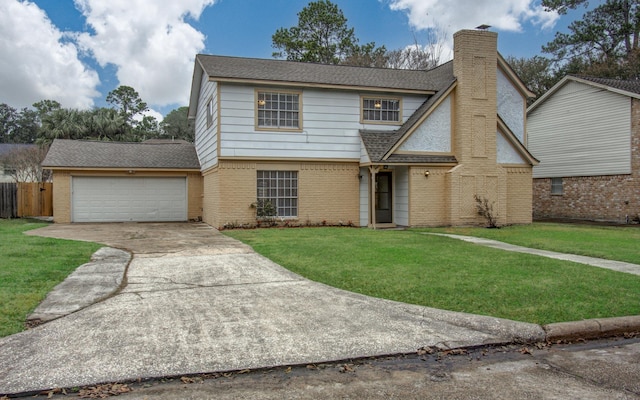 view of front facade with a garage and a front lawn