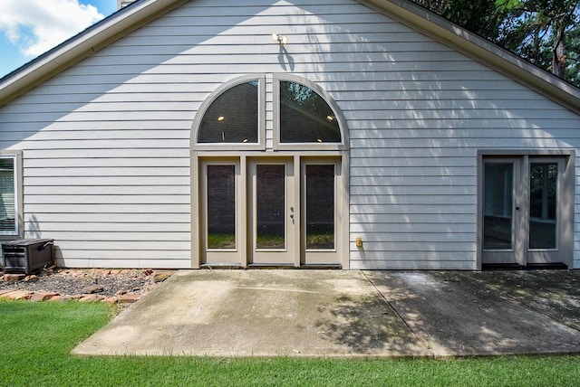 back of property featuring central AC unit, a patio area, and french doors