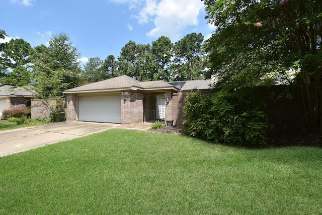 single story home with a garage and a front yard