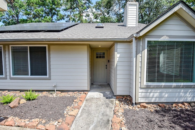 doorway to property with solar panels