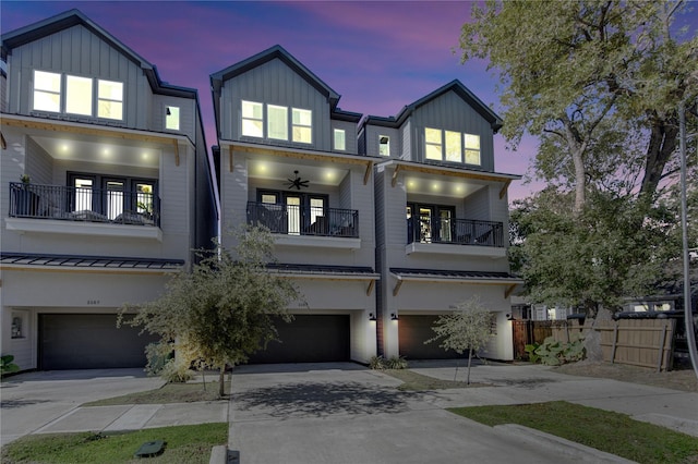 view of front of house with a garage and a balcony