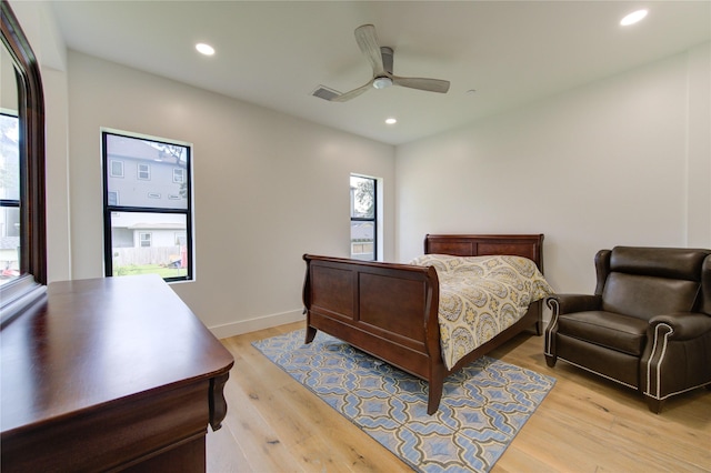 bedroom featuring ceiling fan and light hardwood / wood-style flooring