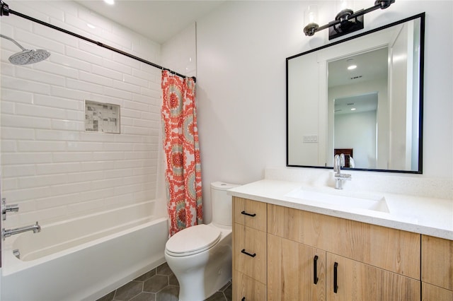 full bathroom featuring vanity, toilet, tile patterned flooring, and shower / bath combo