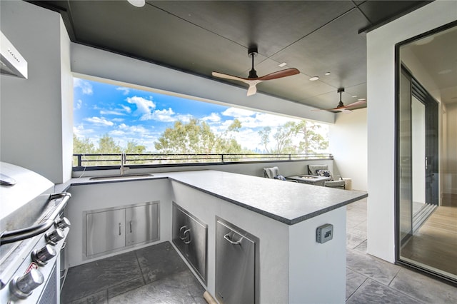 view of patio / terrace featuring ceiling fan, an outdoor kitchen, a grill, and sink