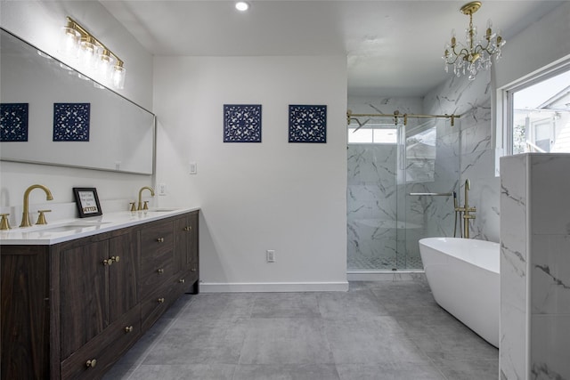 bathroom with vanity, plus walk in shower, and a chandelier