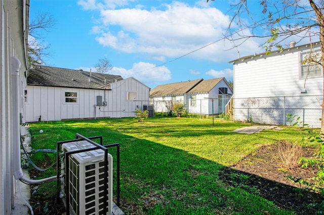 view of yard featuring central air condition unit