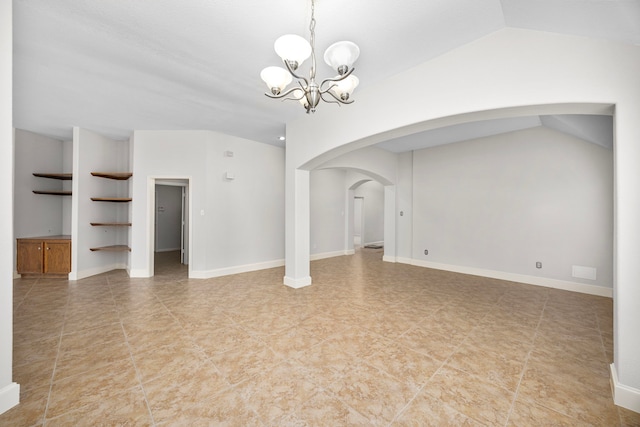 interior space featuring vaulted ceiling and a chandelier