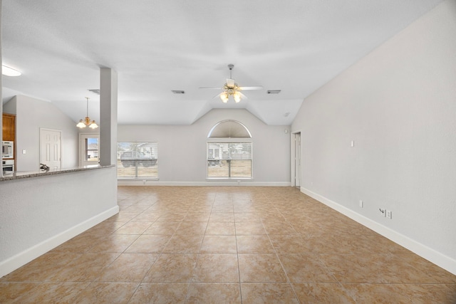 unfurnished living room featuring light tile patterned flooring, ceiling fan, and lofted ceiling