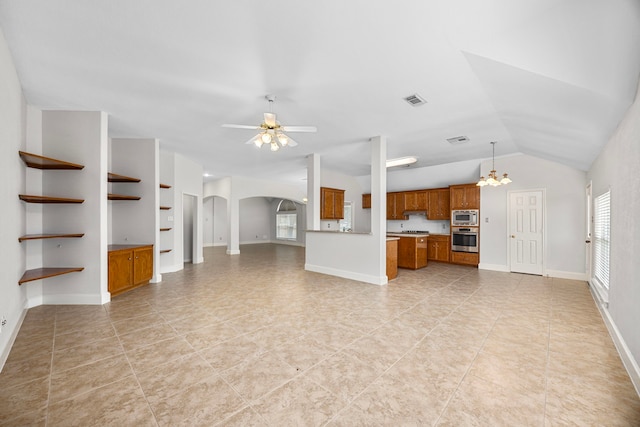 unfurnished living room with vaulted ceiling, ceiling fan with notable chandelier, built in features, and light tile patterned floors