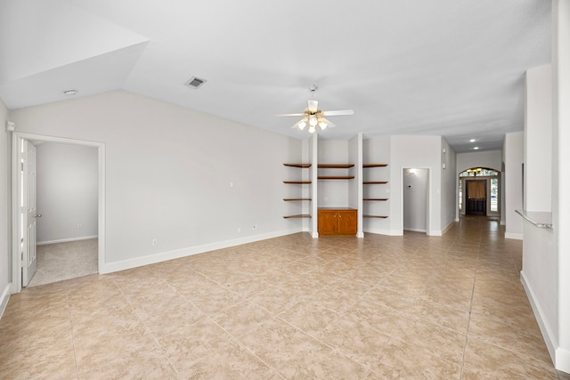 unfurnished living room with vaulted ceiling, built in features, and ceiling fan