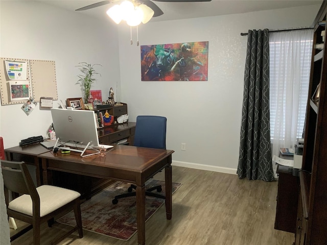 home office featuring ceiling fan and wood-type flooring