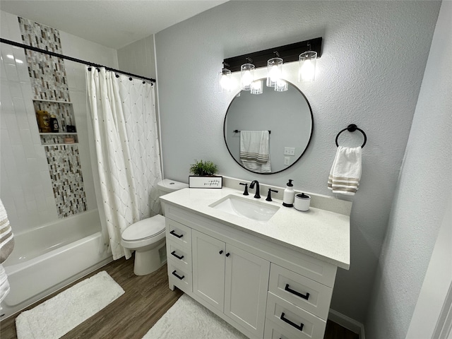 full bathroom with vanity, hardwood / wood-style floors, shower / tub combo with curtain, and toilet