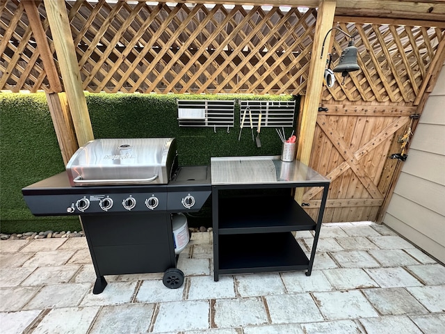 view of patio featuring a grill