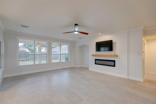 unfurnished living room with crown molding and ceiling fan