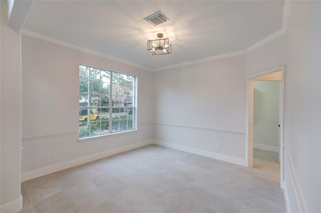 unfurnished room with crown molding