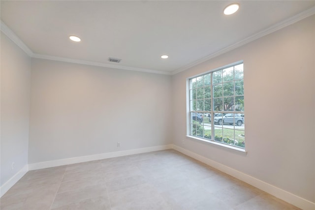 unfurnished room with ornamental molding