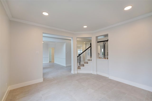 spare room featuring crown molding