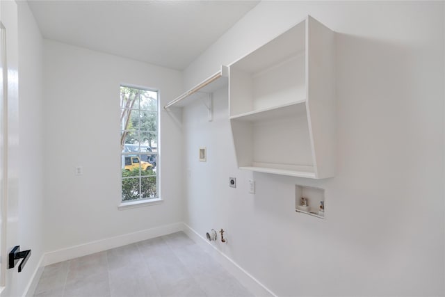 washroom with hookup for a washing machine, electric dryer hookup, a wealth of natural light, and hookup for a gas dryer