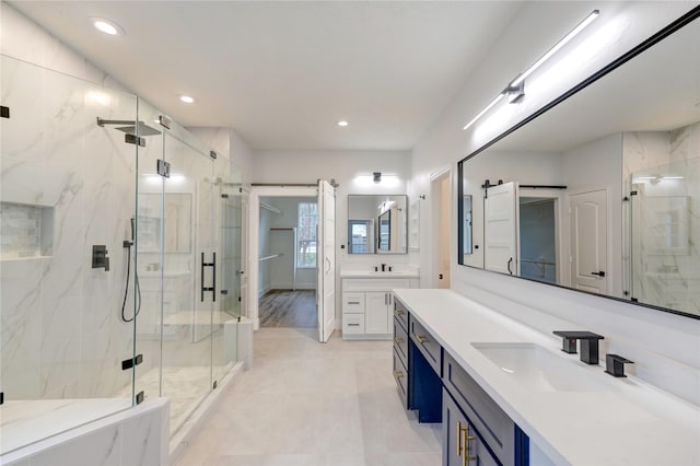 bathroom with walk in shower and vanity