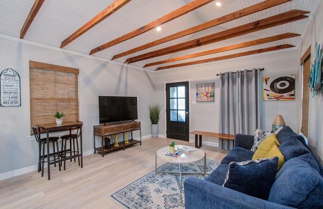 living room featuring hardwood / wood-style floors and lofted ceiling with beams