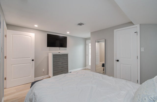 bedroom with light hardwood / wood-style floors