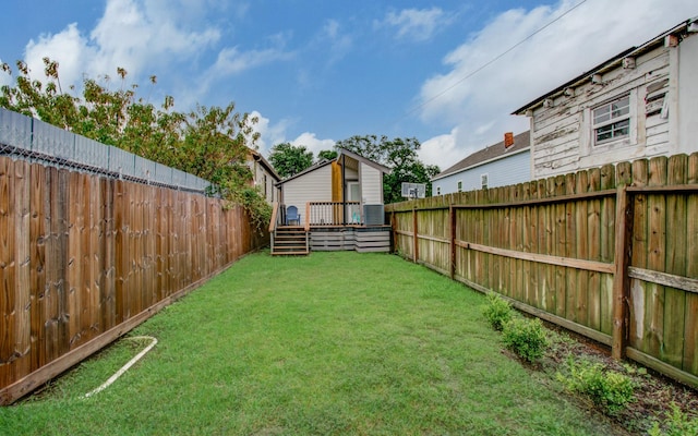 view of yard with a wooden deck