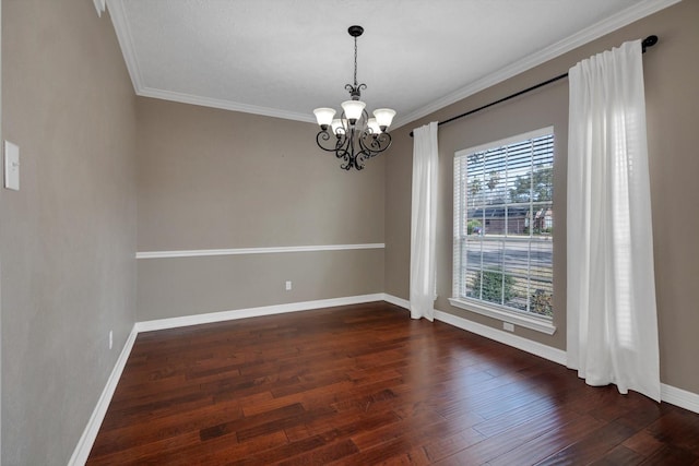 unfurnished room with dark hardwood / wood-style flooring, crown molding, and a chandelier